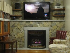Stone veneer surrounding an interior fireplace